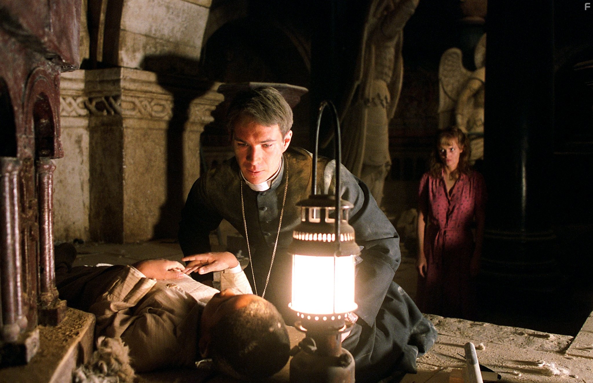 Izabella Scorupco, James D'Arcy, and Remy Sweeney in Изгоняющий дьявола: Начало (2004)