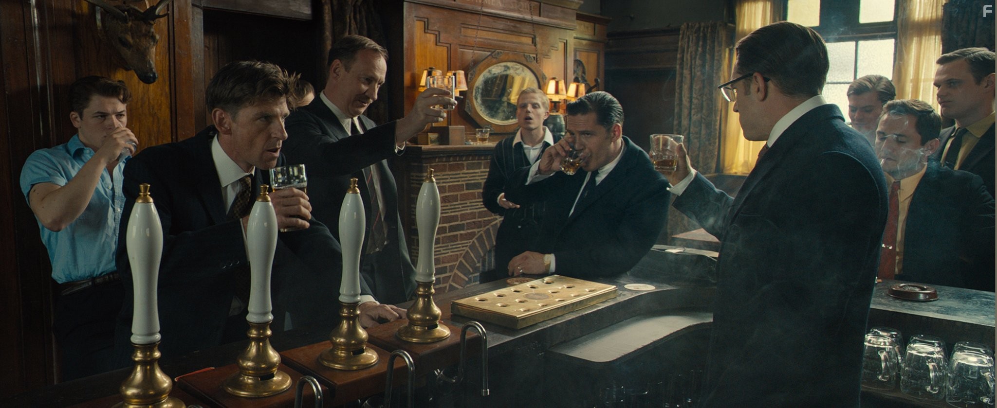 Tom Hardy and Taron Egerton in Легенды (2015)