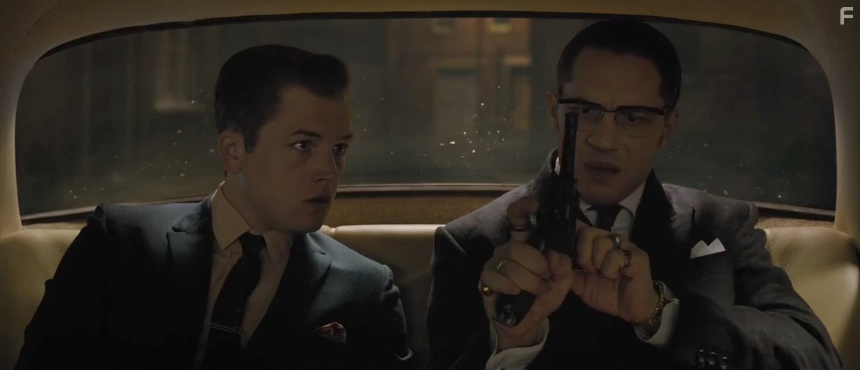 Tom Hardy and Taron Egerton in Легенды (2015)