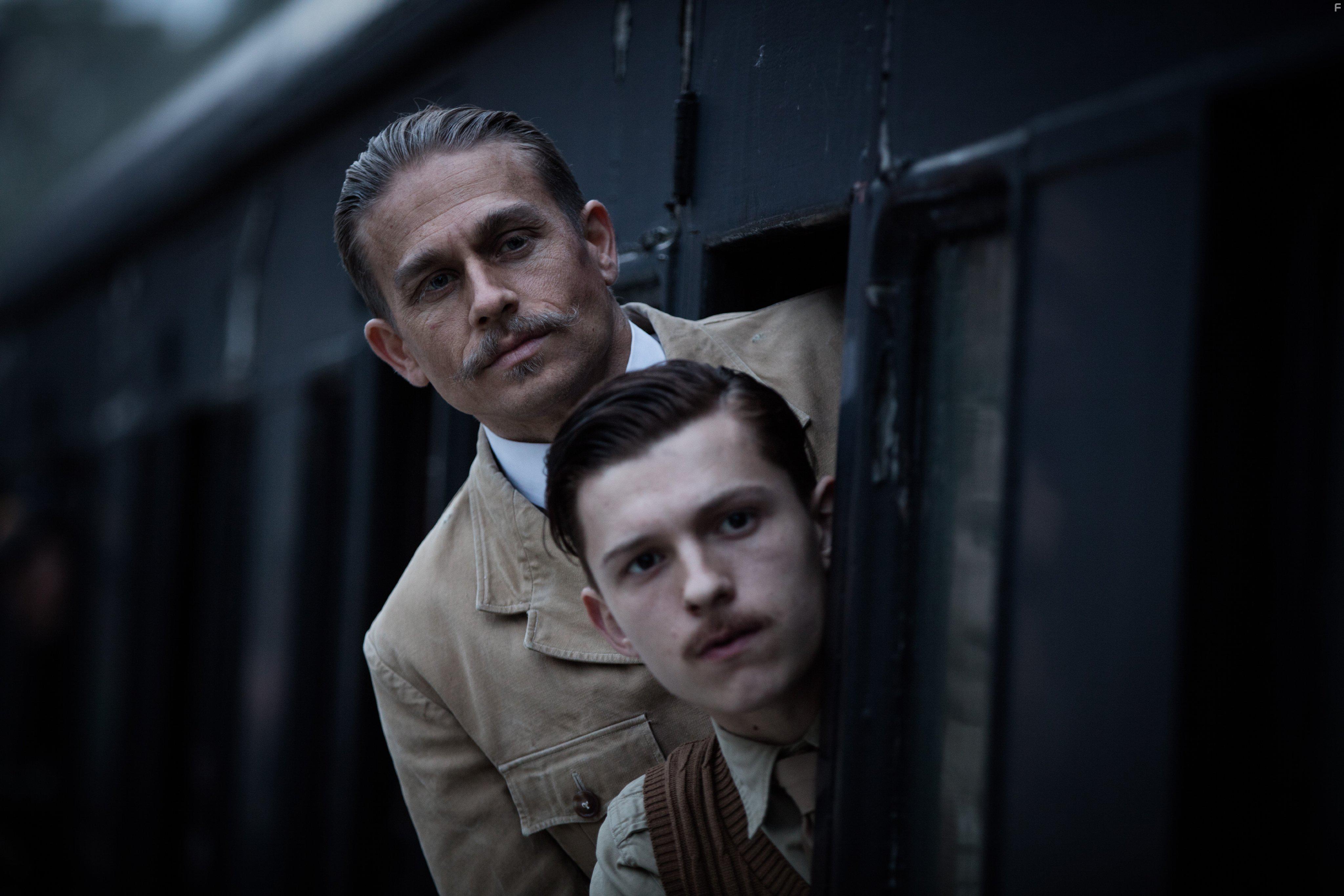 Charlie Hunnam and Tom Holland in The Lost City of Z (2016)