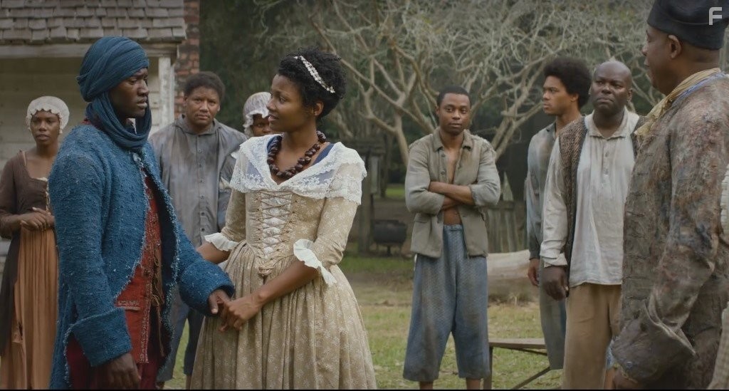 Forest Whitaker, Emayatzy Corinealdi, and Malachi Kirby in Корни (2016)