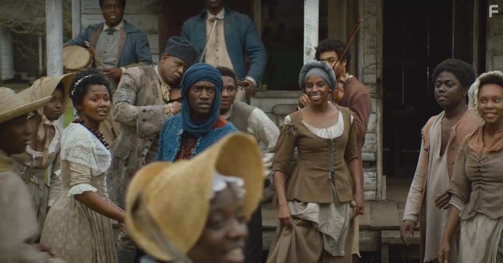 Forest Whitaker, Emayatzy Corinealdi, and Malachi Kirby in Корни (2016)