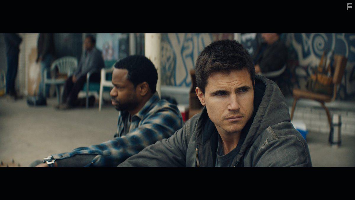Jai Jai Jones and Robbie Amell in Code 8 (2019)