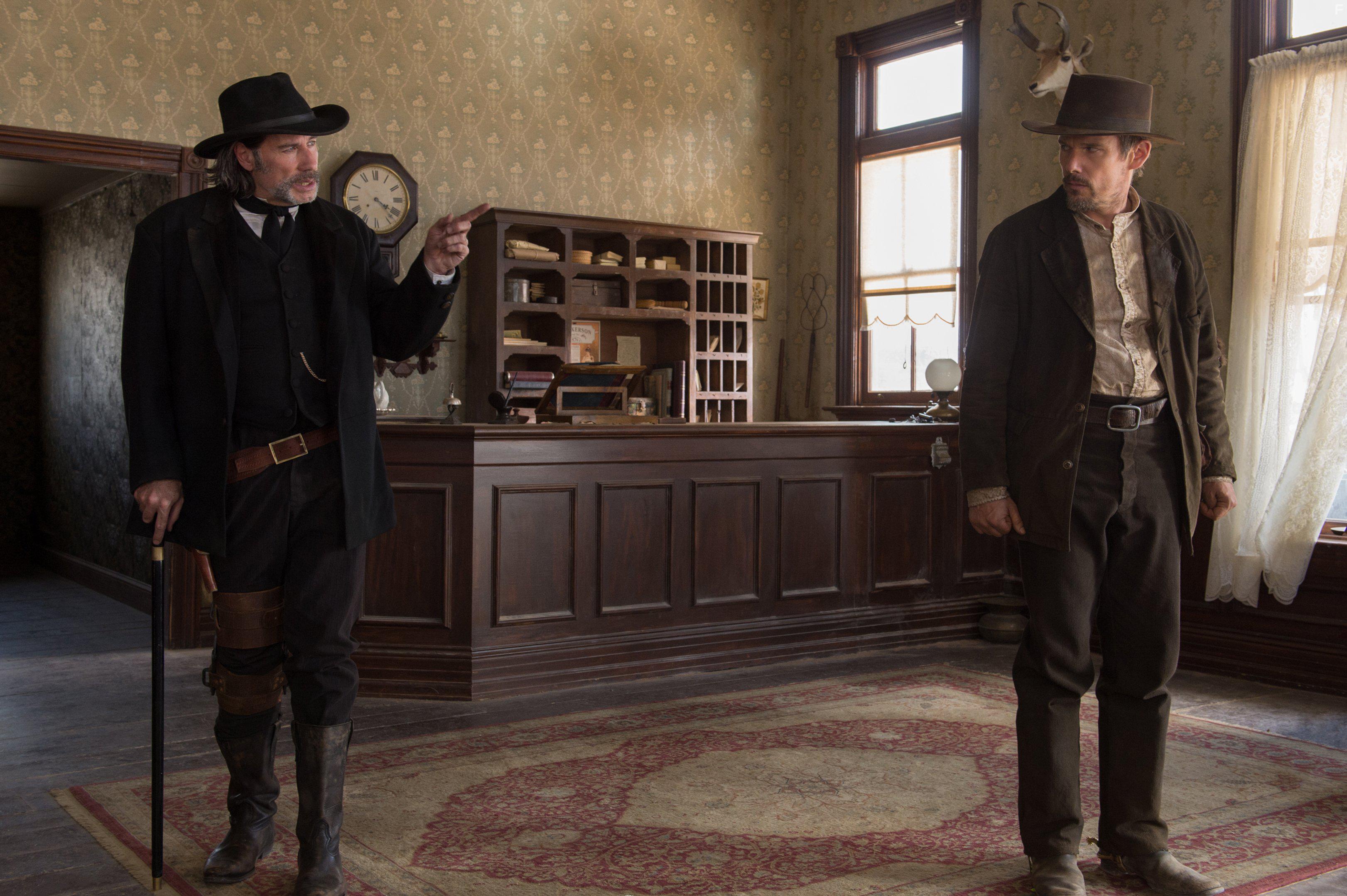 Ethan Hawke and John Travolta in In a Valley of Violence (2016)