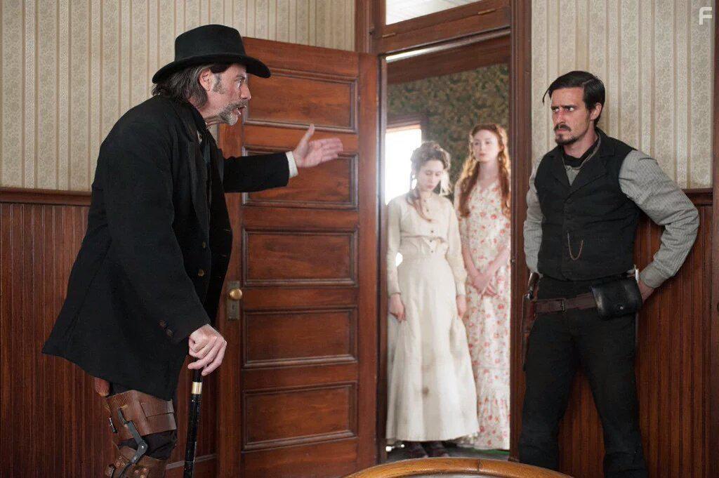 John Travolta, James Ransone, Karen Gillan, and Taissa Farmiga in In a Valley of Violence (2016)