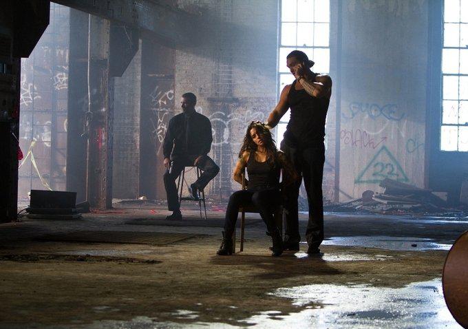 Jason Momoa and Sarah Shahi in Bullet to the Head (2012)
