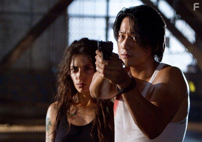 Sung Kang and Sarah Shahi in Bullet to the Head (2012)