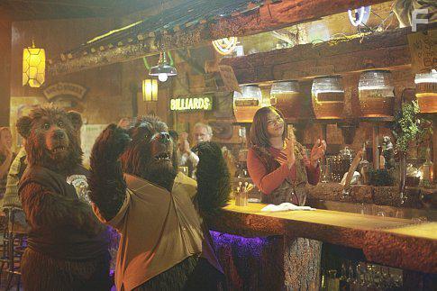 Honey barkeep Cha-Cha (Queen Latifah, right) and two regulars enjoy the entertainment at her establishment.