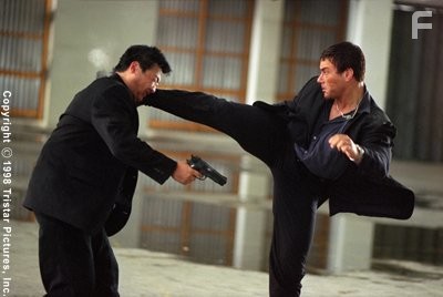 Jean-Claude gives a thug a boot to the head