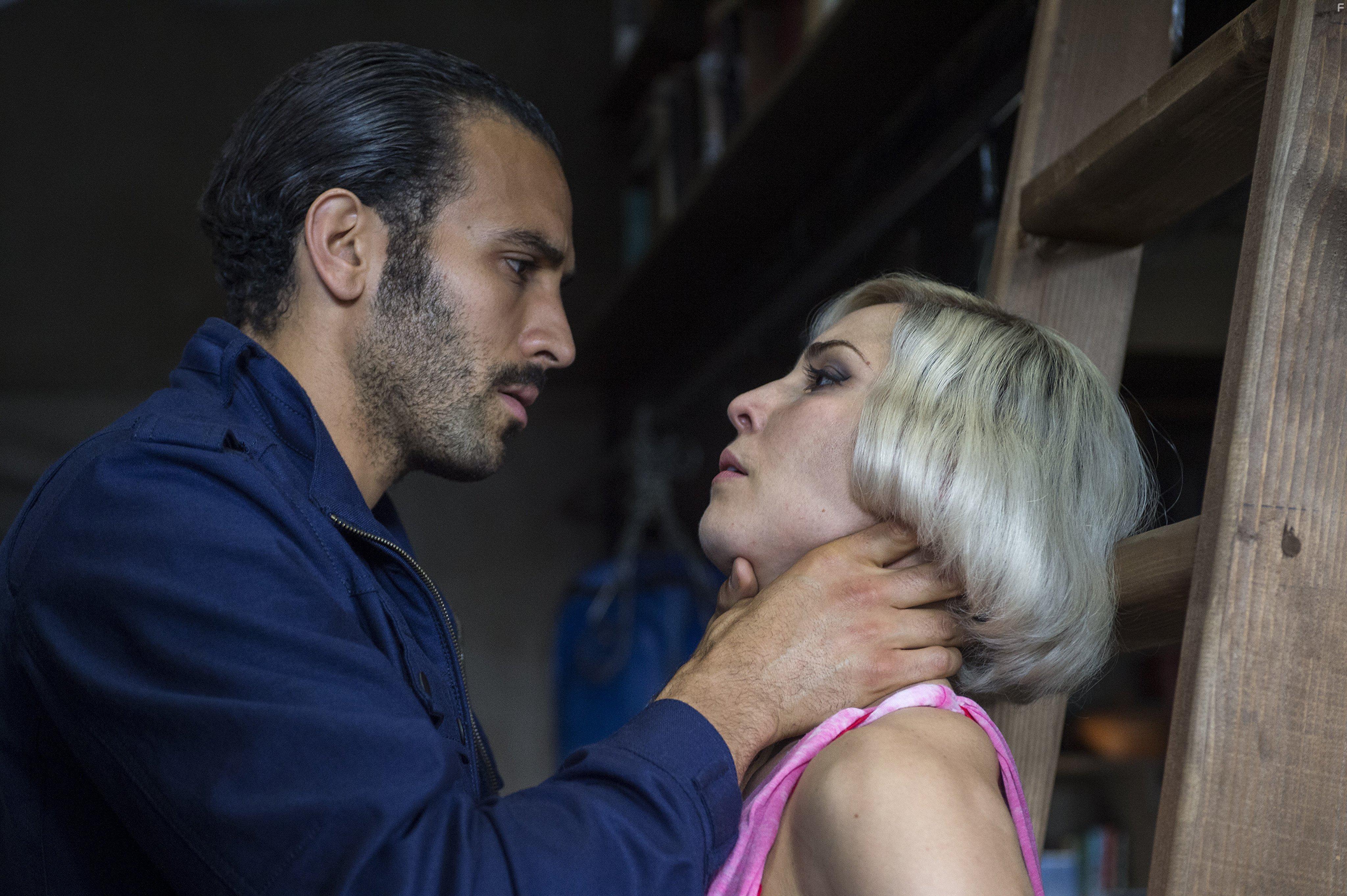 Noomi Rapace and Marwan Kenzari in Seven Sisters (2017)