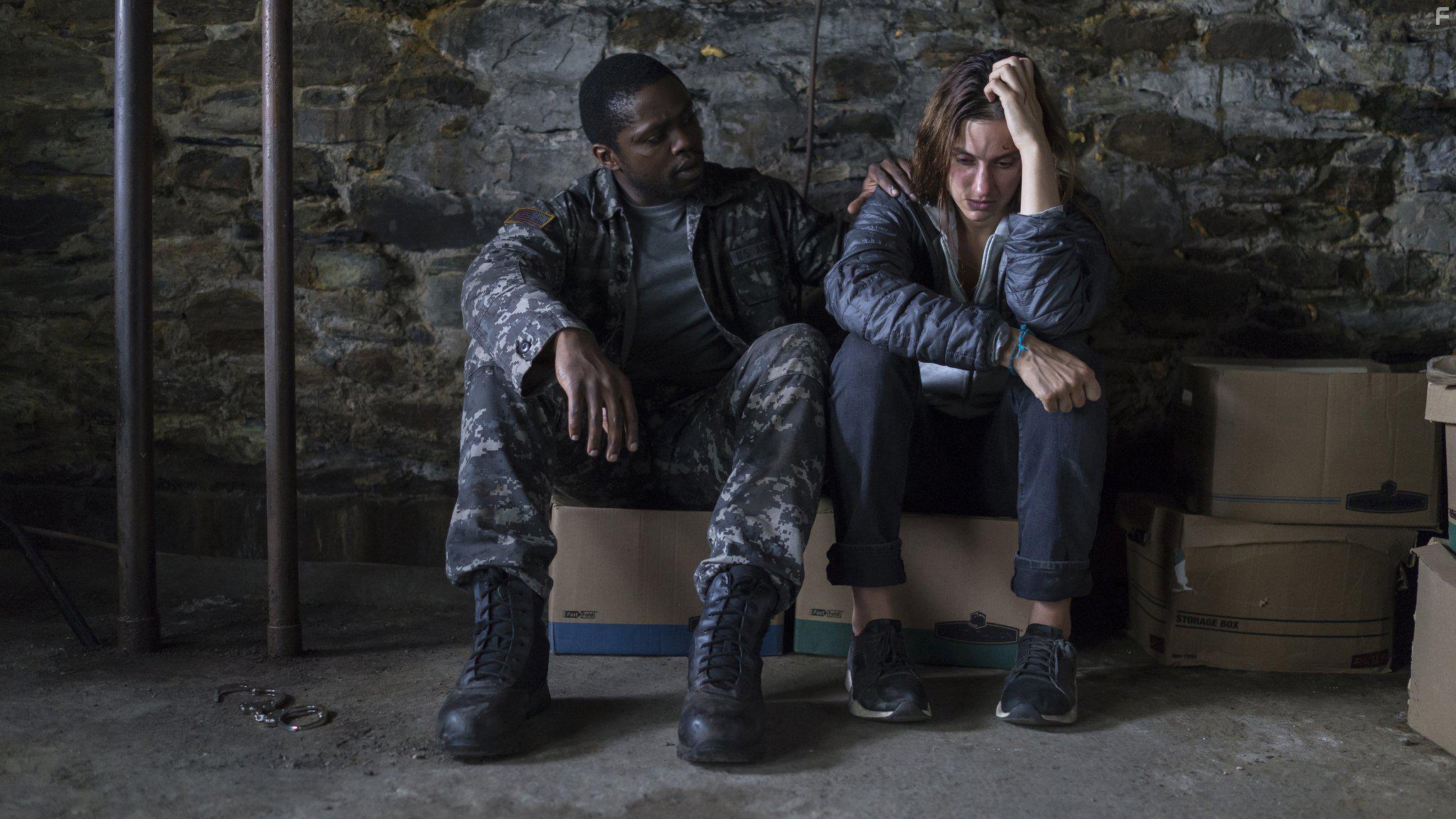 Okezie Morro and Danica Curcic in The Mist (2017)