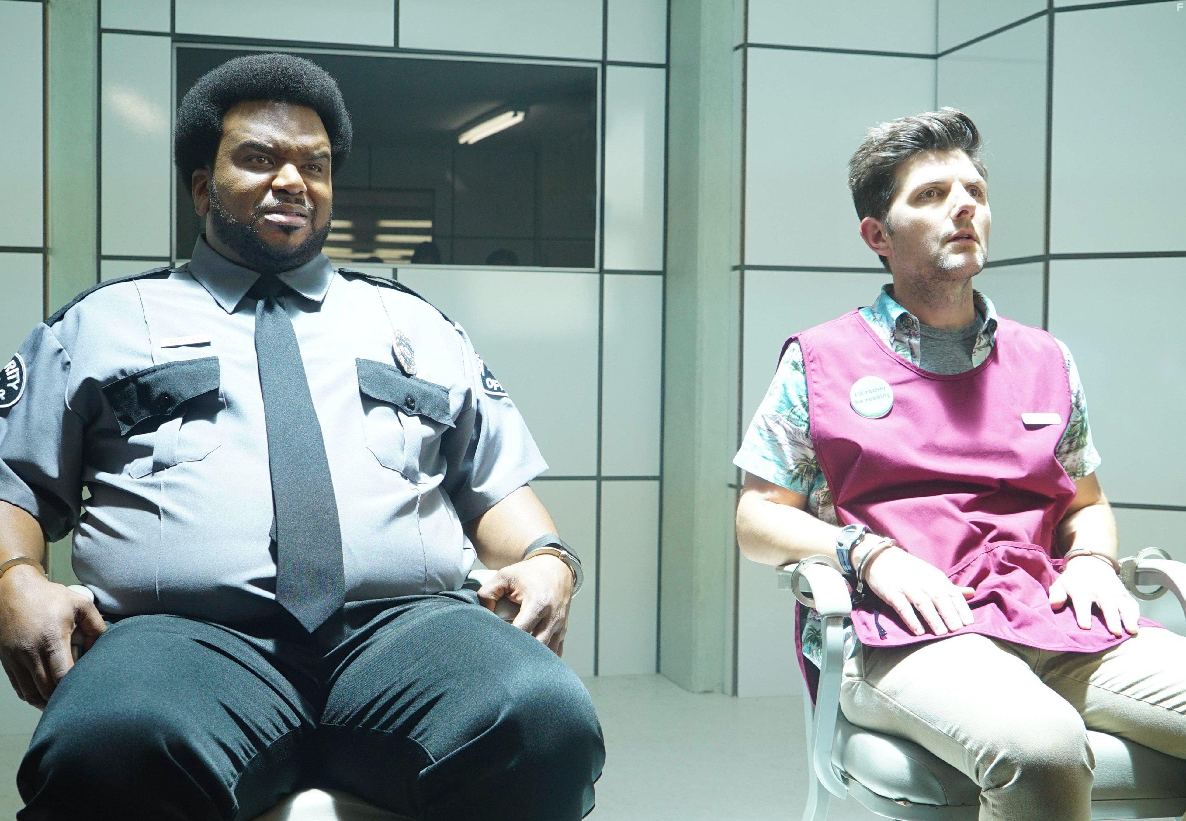 Adam Scott and Craig Robinson in Ghosted (2017)
