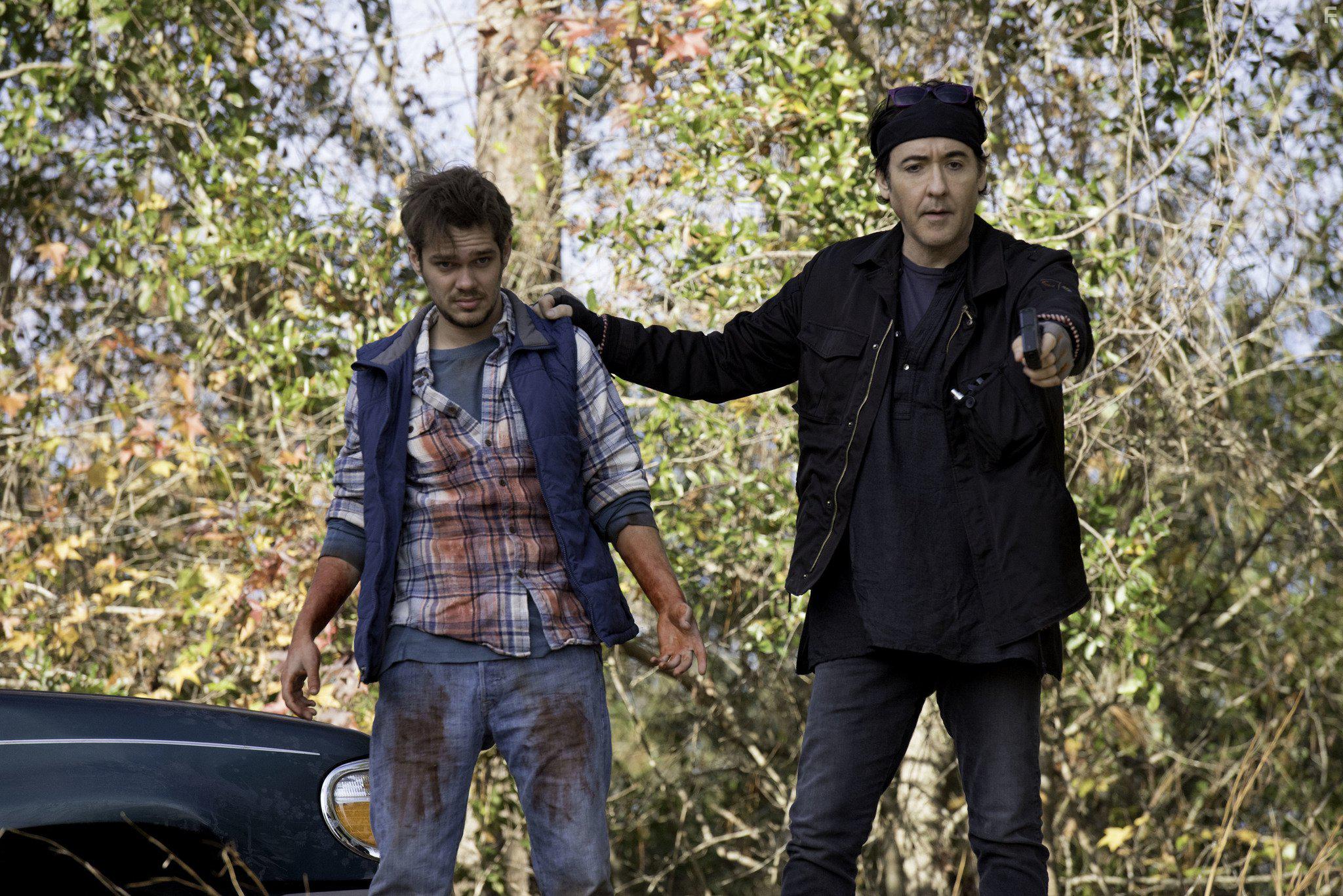 John Cusack and Ellar Coltrane in Blood Money (2017)