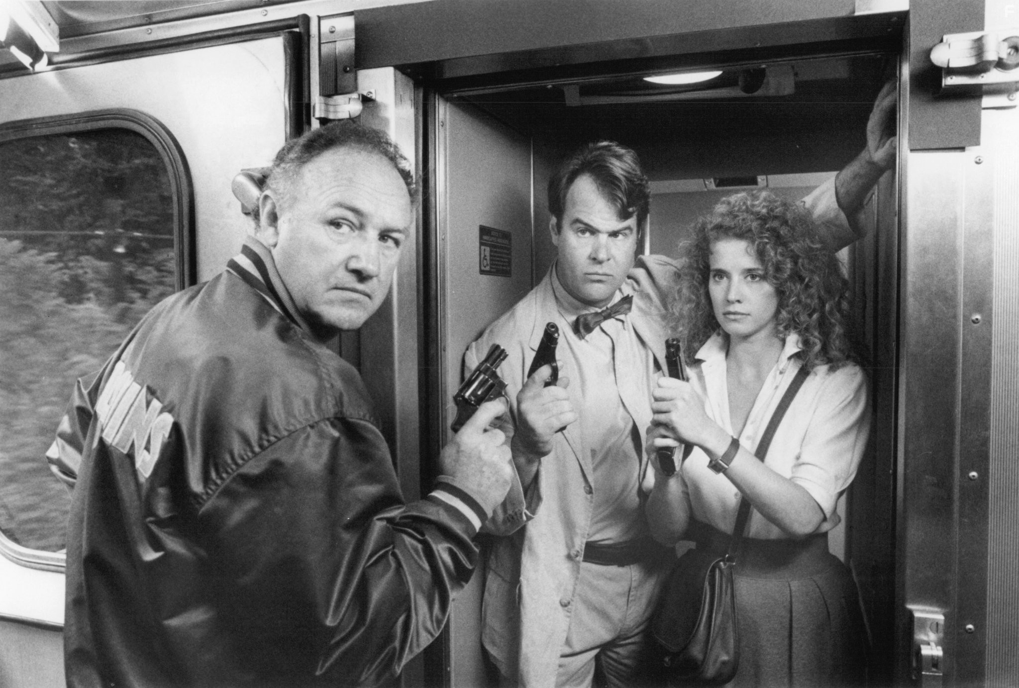 Dan Aykroyd, Gene Hackman, and Nancy Travis in Большой калибр (1990)