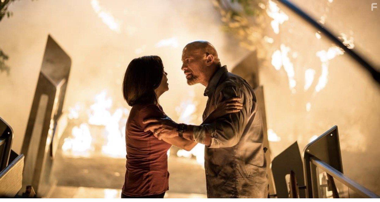 Neve Campbell and Dwayne Johnson in Skyscraper (2018)