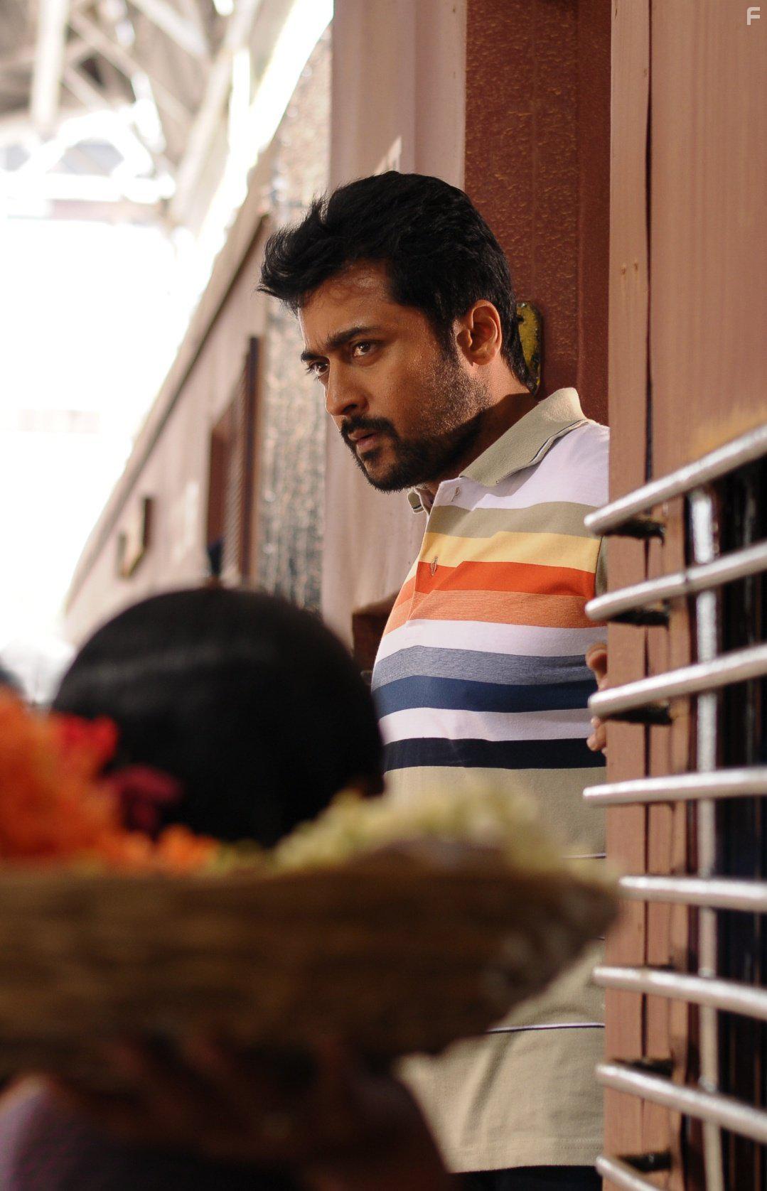 Ramya Krishnan, Suriya, and Keerthi Suresh in Thaanaa Serndha Koottam (2018)