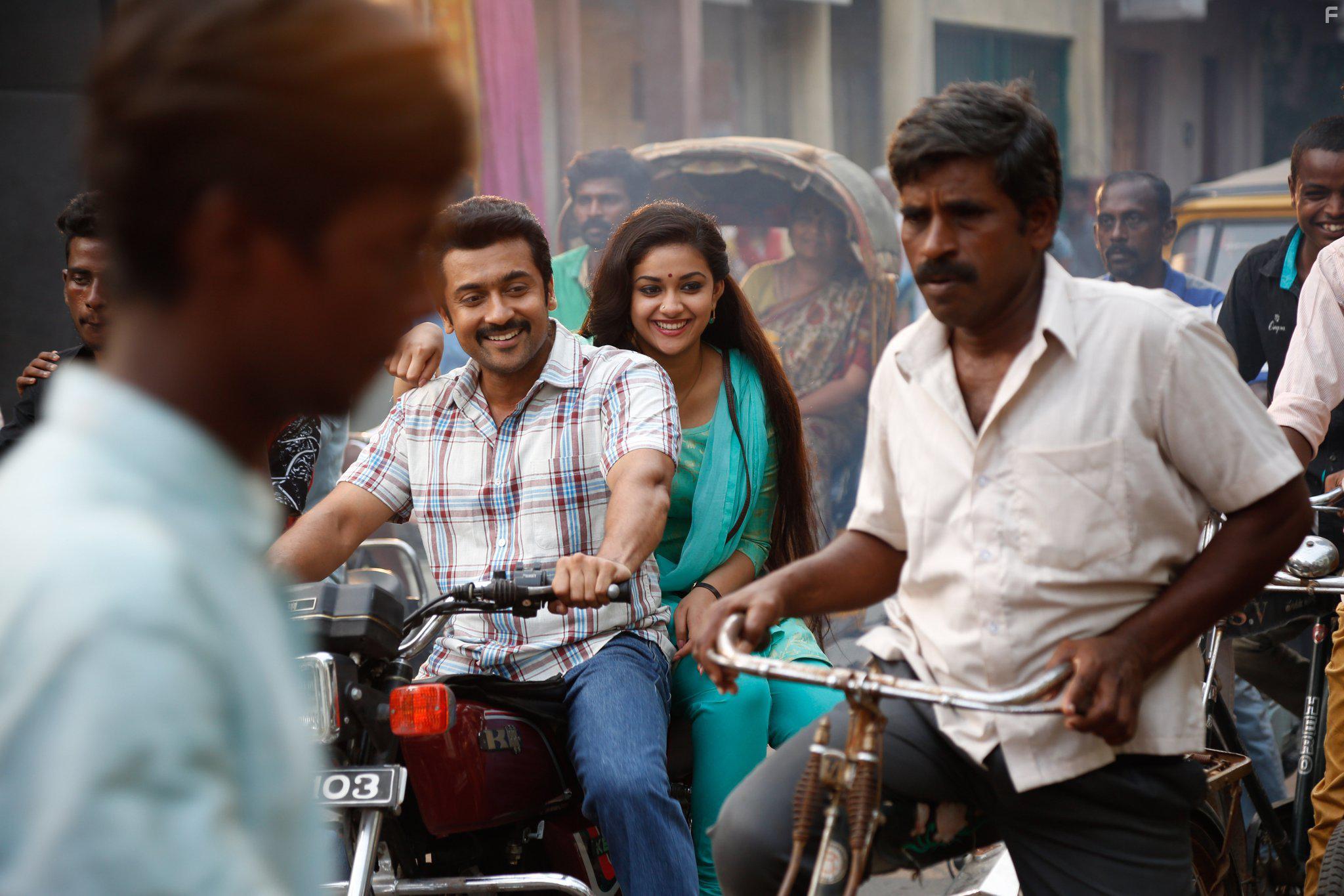 Suriya and Keerthi Suresh in Thaanaa Serndha Koottam (2018)