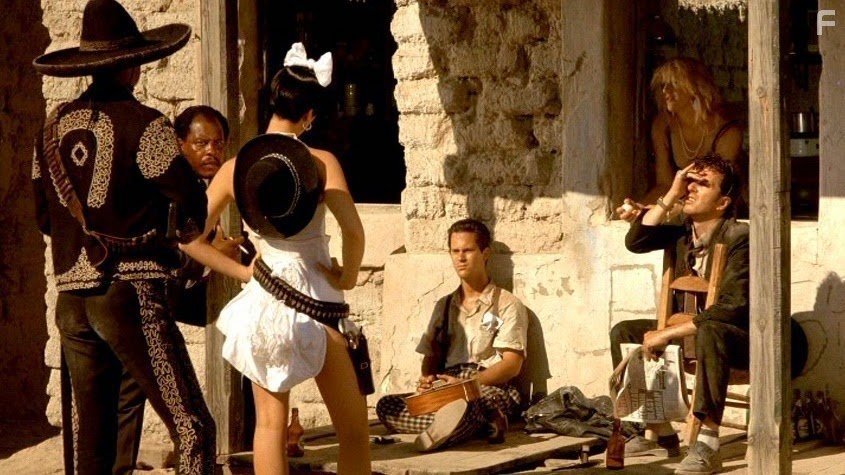 Courtney Love, Sy Richardson, Dick Rude, and Joe Strummer in Прямо в ад (1986)