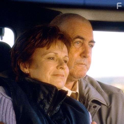 (Left) Annie (Walters, left) and husband, John (John Alderton, right)