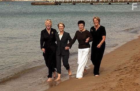 Two of the original "calendar girls" - Tricia Stewart (left) and Angela Baker (right) take a walk with the stars who portray the characters based on their lives: Helen Mirren (center left) and Julie Walters (center right)