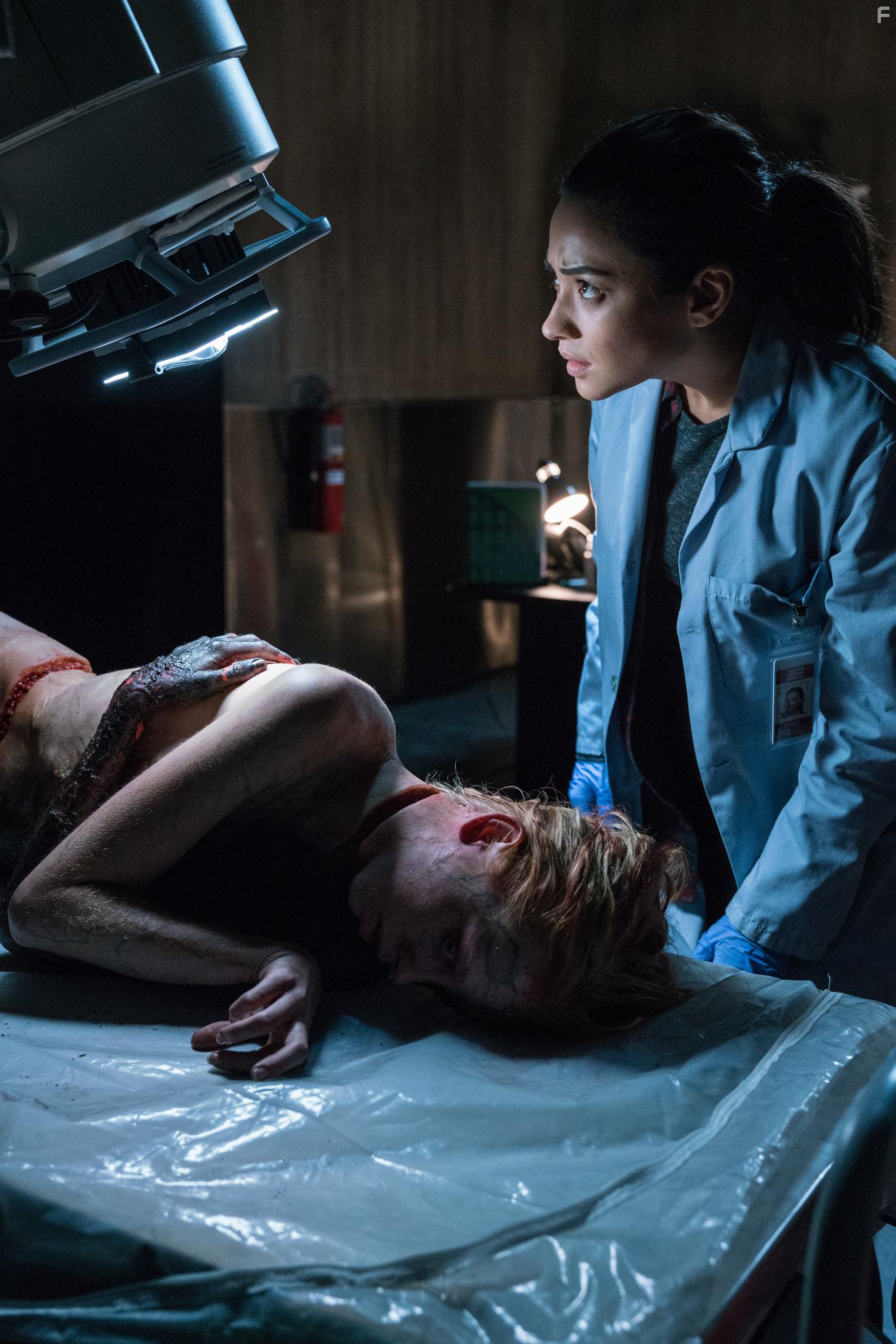 Shay Mitchell and Kirby Johnson in The Possession of Hannah Grace (2018)