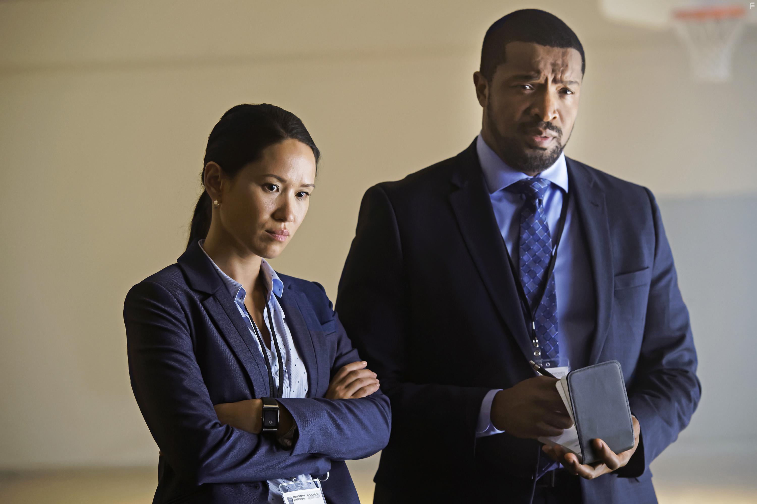 Roger Cross and Alli Chung in Coroner (2019)