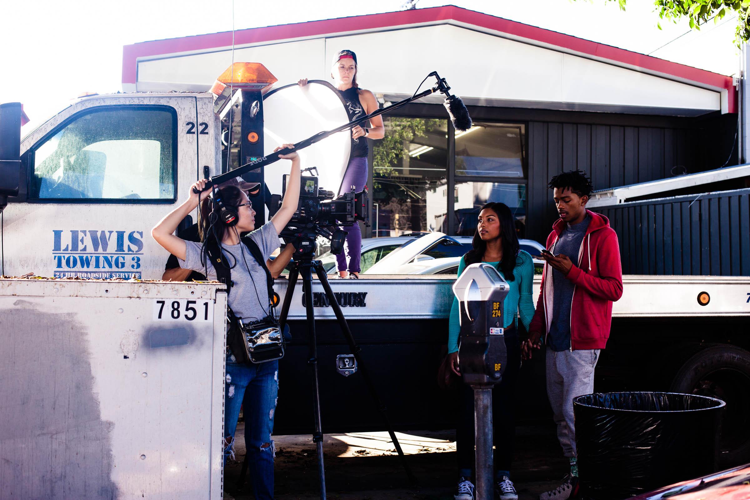 Thayvi Ganeshalingam and Norman Johnson Jr. in Induced Effect (2019)