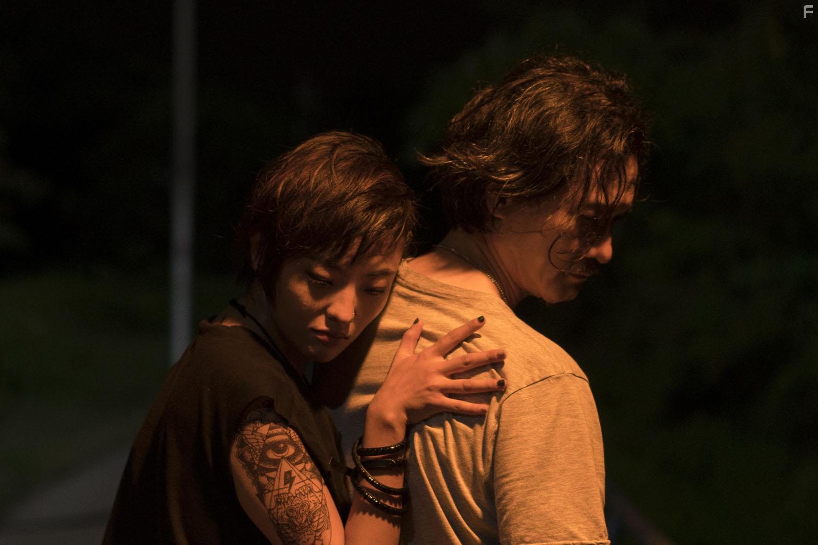 Yue Guo and Peter Yu in A Land Imagined (2018)