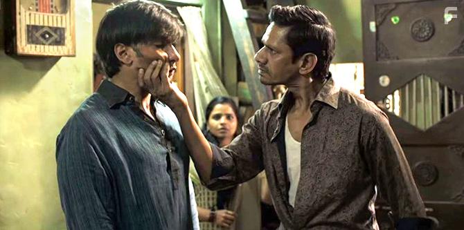 Vijay Raaz, Amruta Subhash, and Ranveer Singh in Gully Boy (2019)