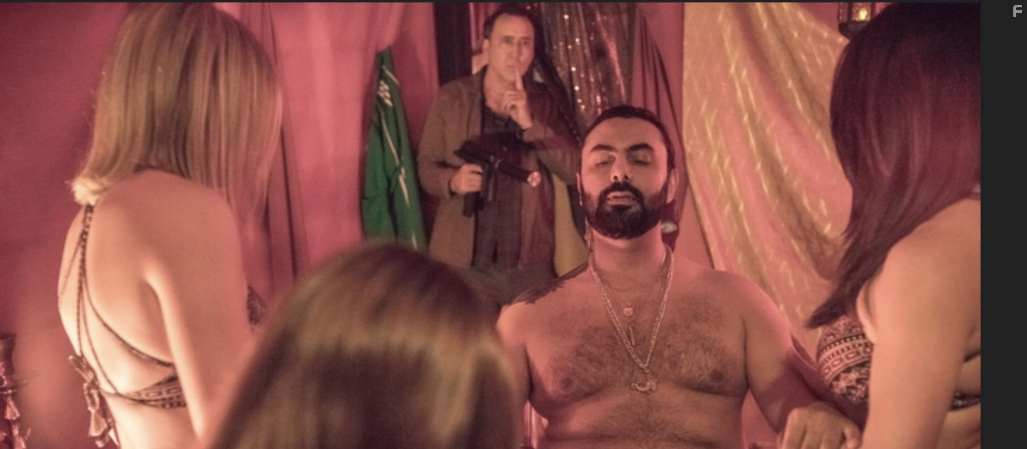 Nicolas Cage and Mohamed Karim in A Score to Settle (2019)