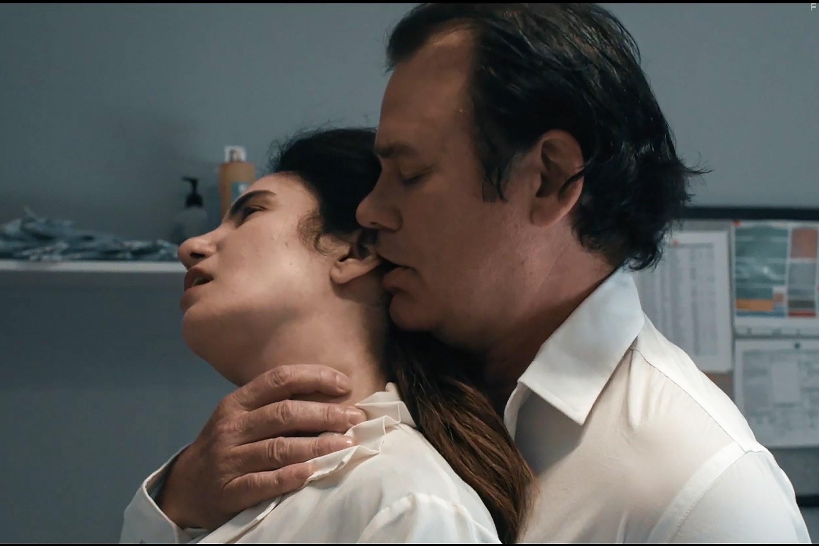 Vida Ghaffari and Richard Tyson in Eternal Code