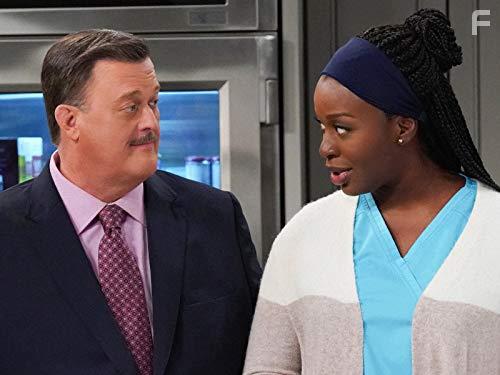 Billy Gardell and Folake Olowofoyeku in Bob Hearts Abishola (2019)