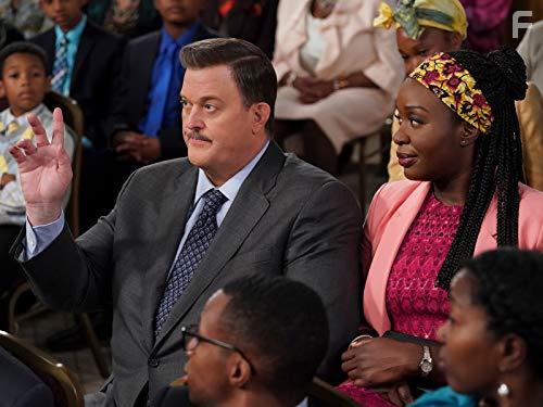Billy Gardell and Folake Olowofoyeku in Bob Hearts Abishola (2019)