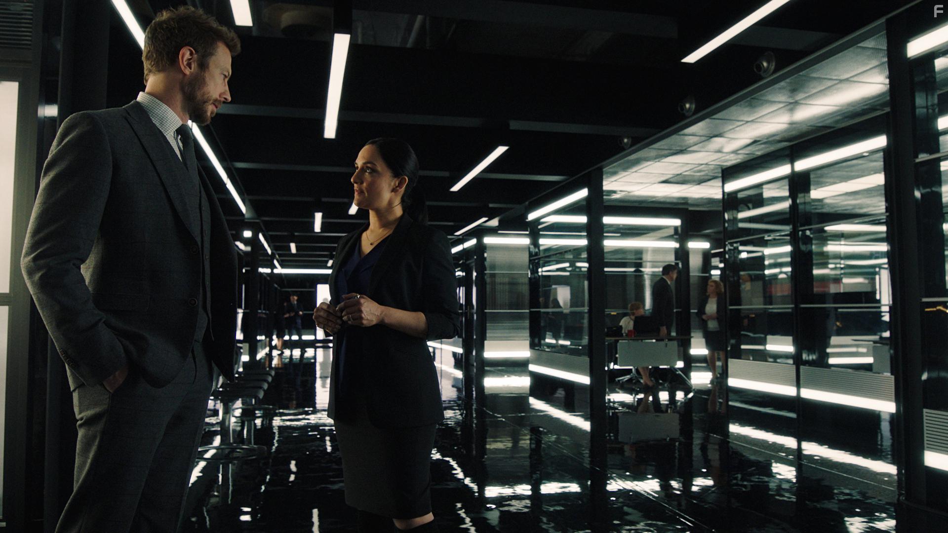 Kris Holden-Ried and Archie Panjabi in Departure (2019)