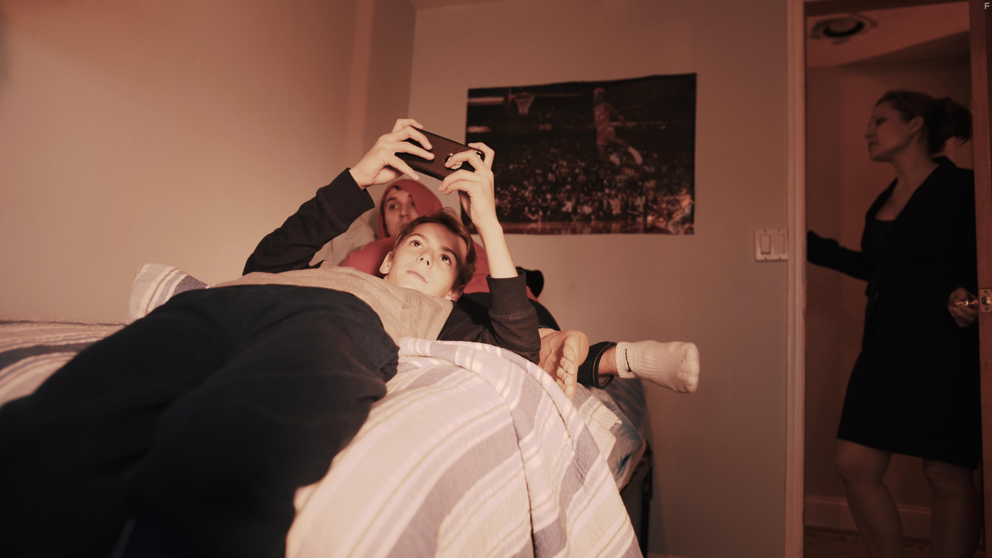 Leah Gallimore, Derek Long, and John Madsen in Not Alone (2019)