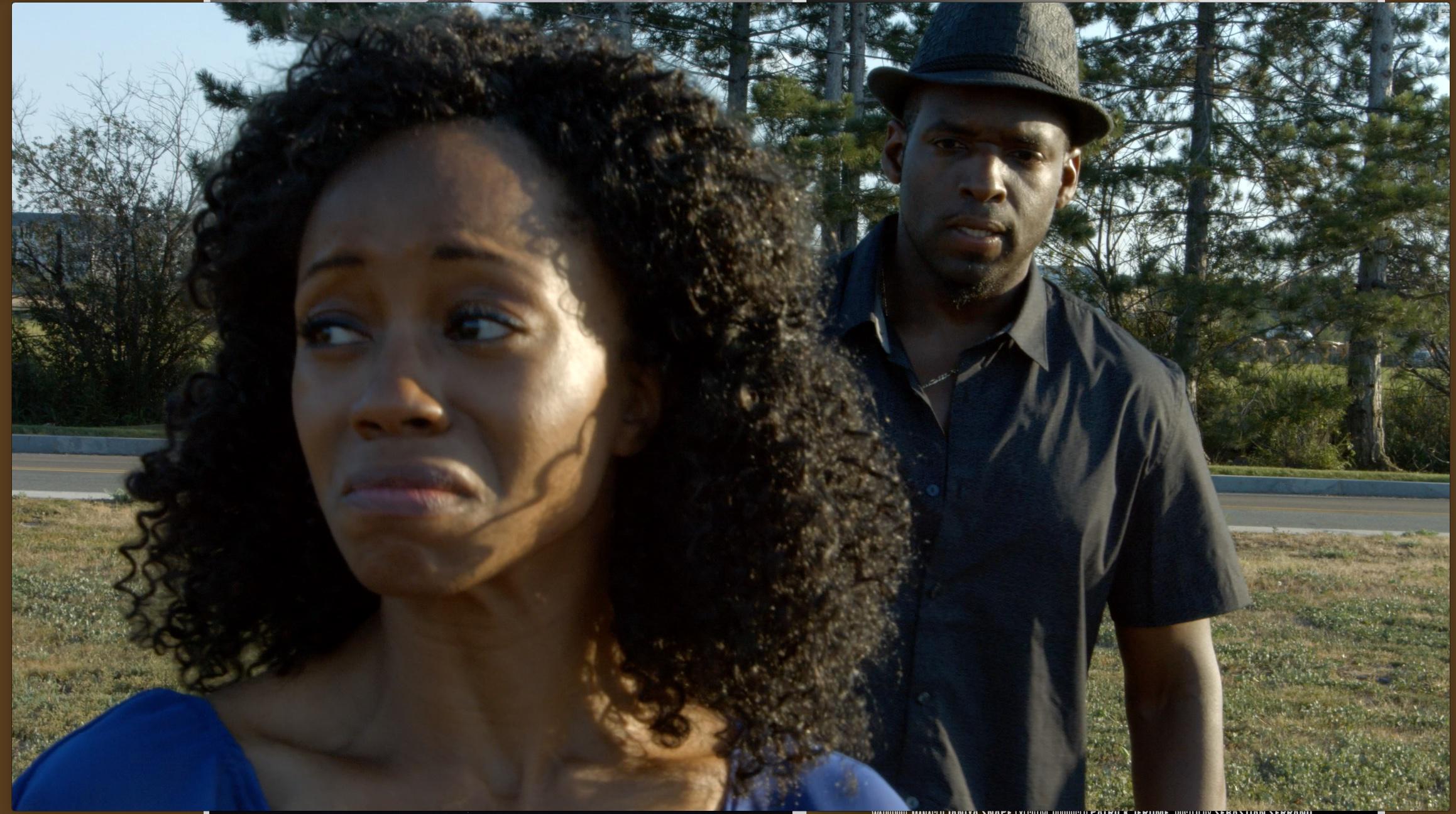 Chandra Thomas and Scott Neufville in Assassin Behind the Glass (2018)