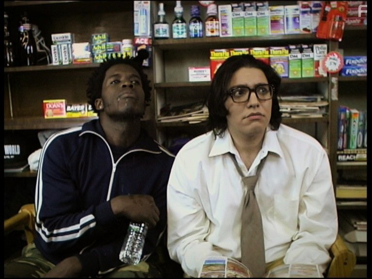 Godfrey plays the resident pothead.  Gargles some water next to the resident OCD maniac played by Jayson Simba.