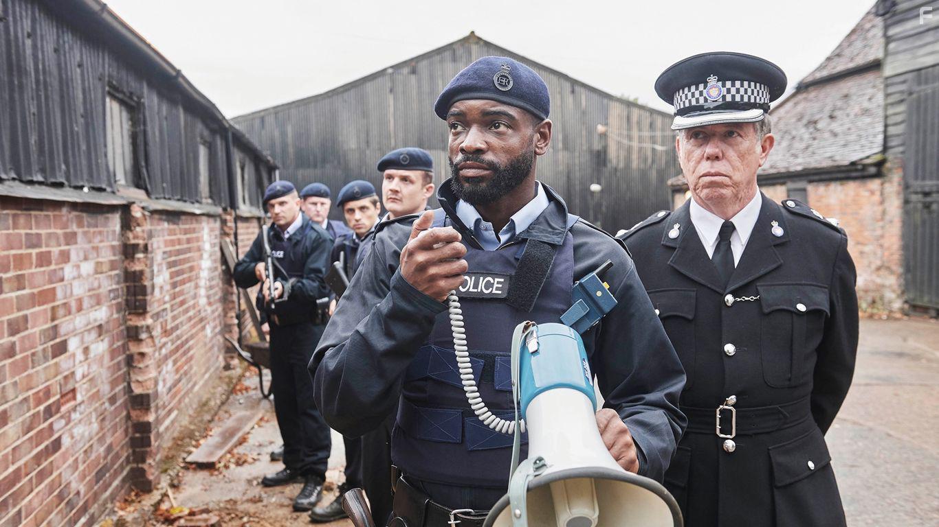 Sean Gilder and Micah Balfour in White House Farm (2020)