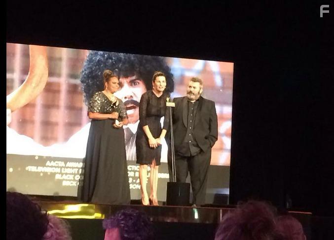 Bec Cole and Craig Anderson accepting the award for Best Director in Television Light Entertainment or Reality for Black Comedy. Joined by writer/performer Elizabeth Wymarra.