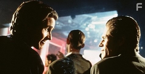 Christian Bale and Willem Dafoe in Американский психопат (2000)