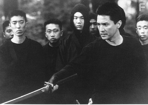 John Lone in Преследуемый (1995)