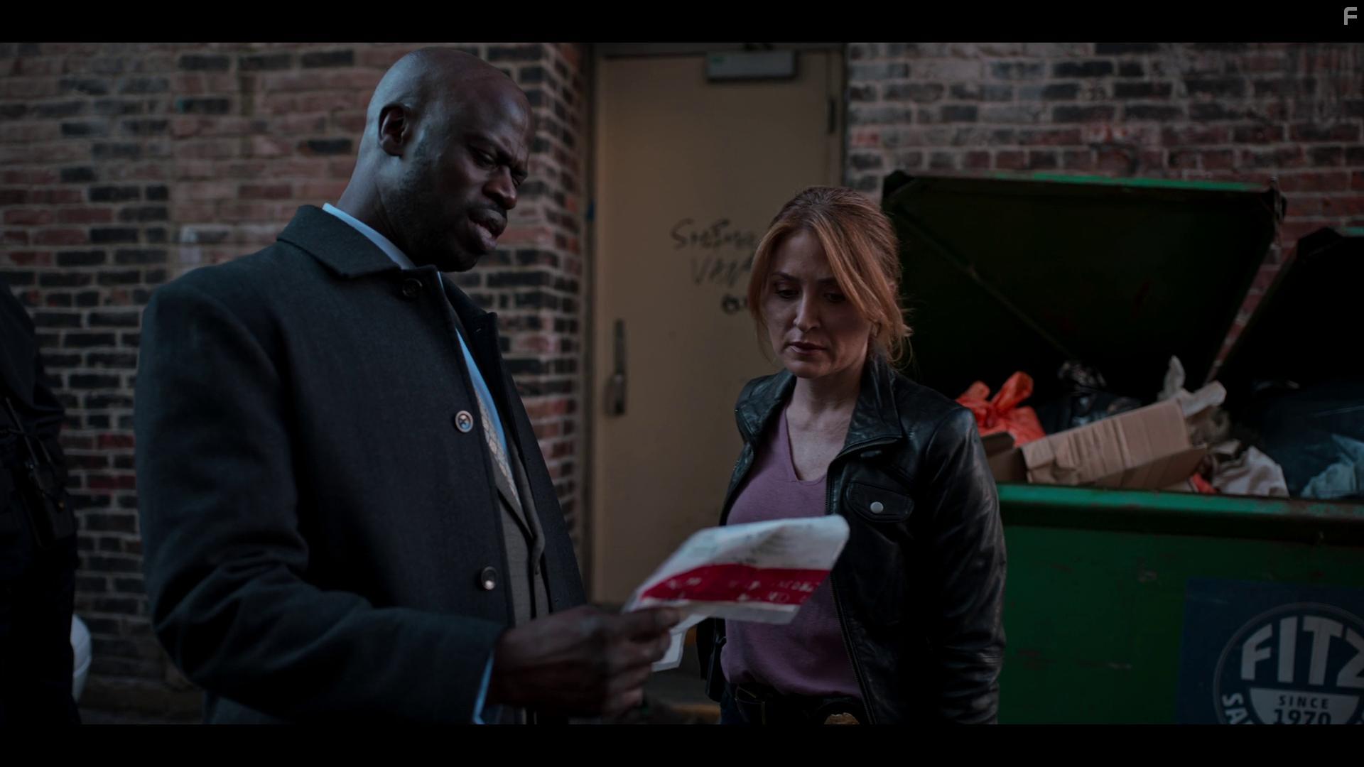 Sasha Alexander and Garfield Wilson in Dangerous Lies (2020)