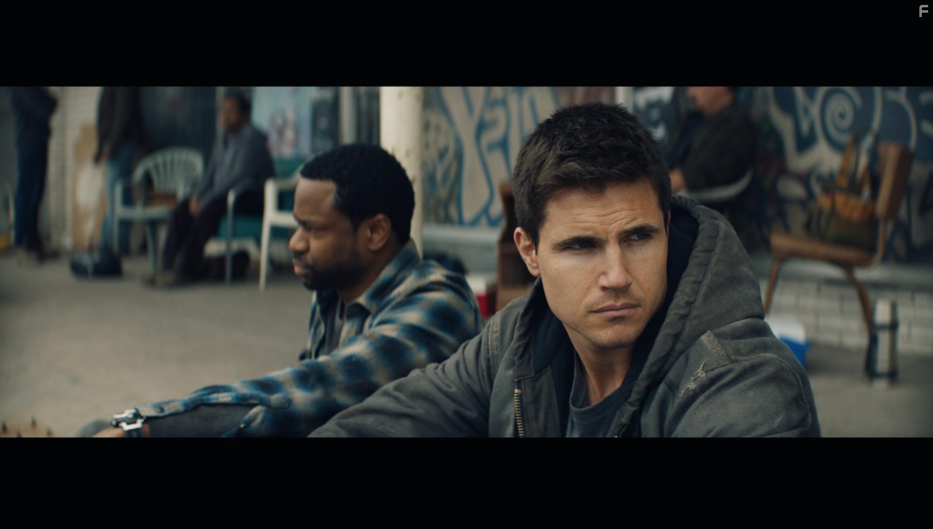 Jai Jai Jones and Robbie Amell in Code 8 (2019)