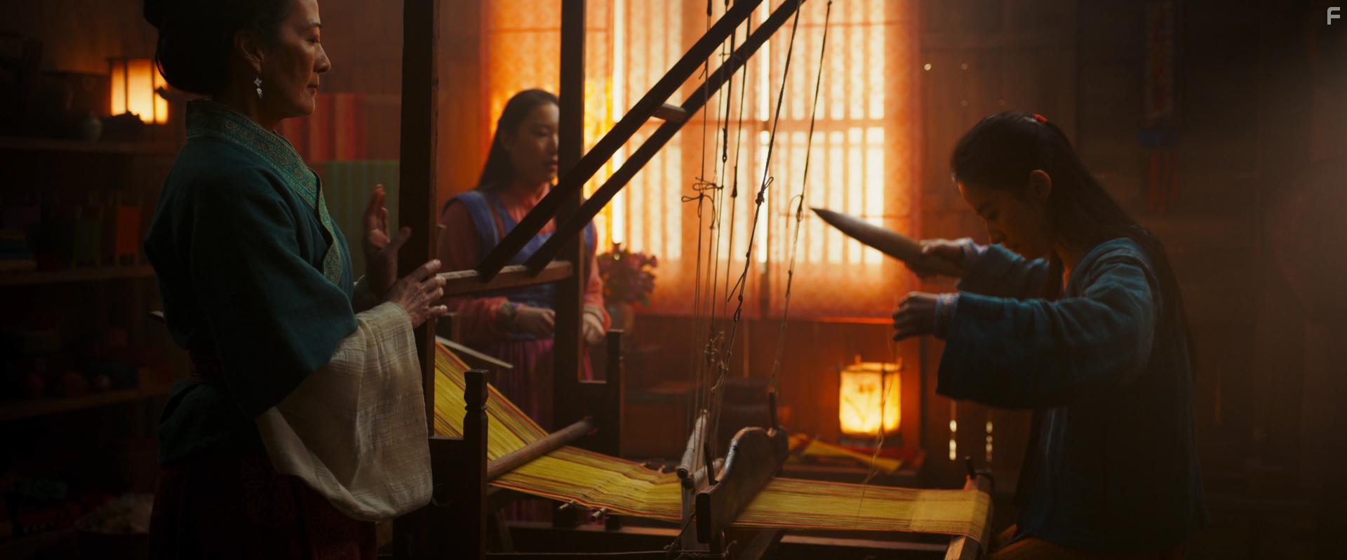 Rosalind Chao, Yifei Liu, and Xana Tang in Mulan (2020)