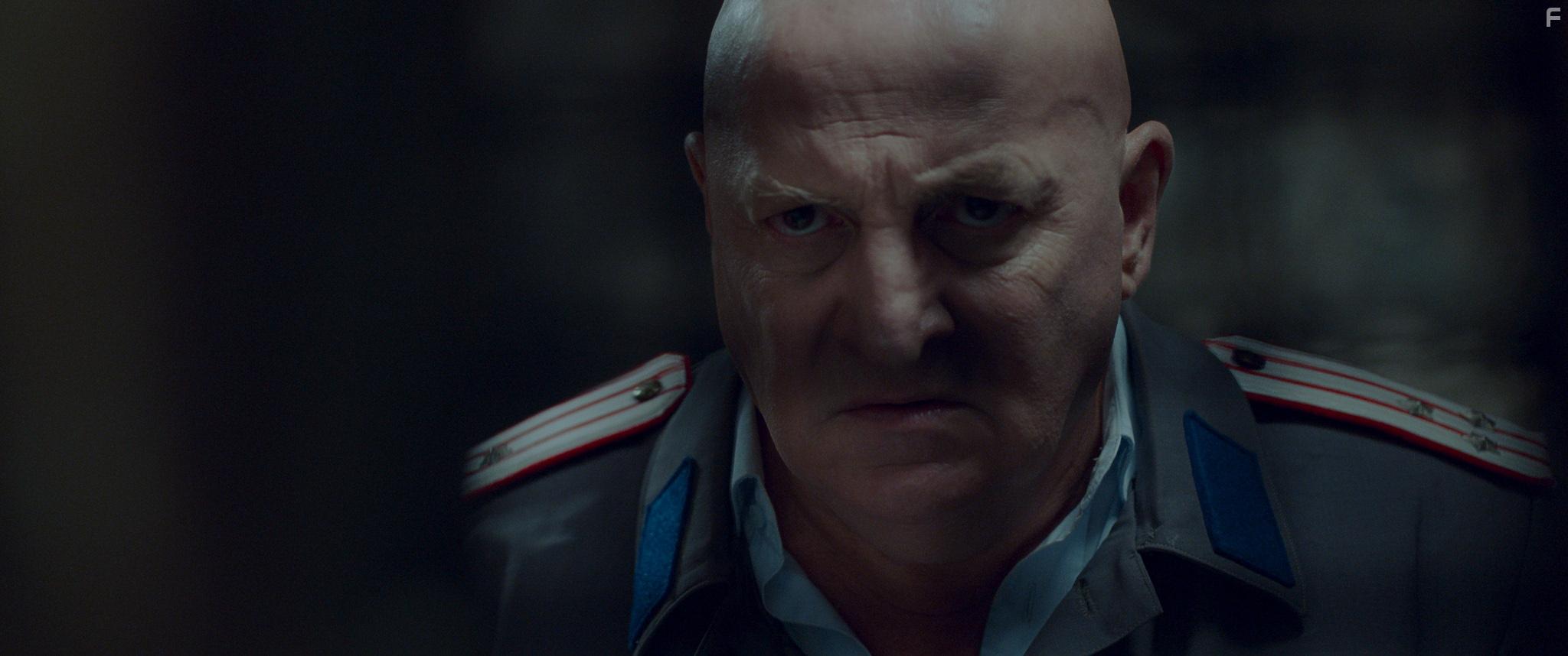 Constantin Cotimanis in Between Pain and Amen (2019)