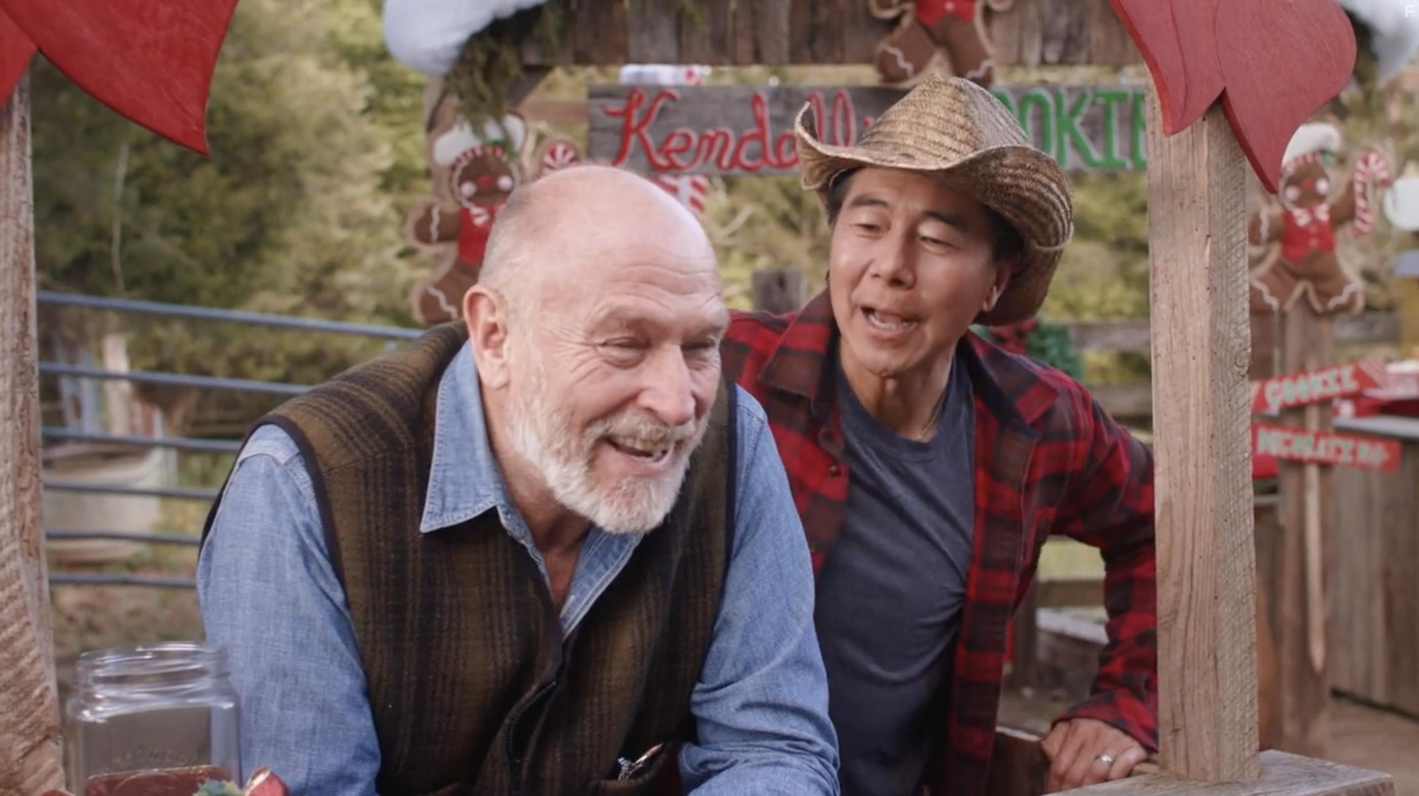 Corbin Bernsen and Henry Cho in The Farmer and the Belle: Saving Santaland (2020)