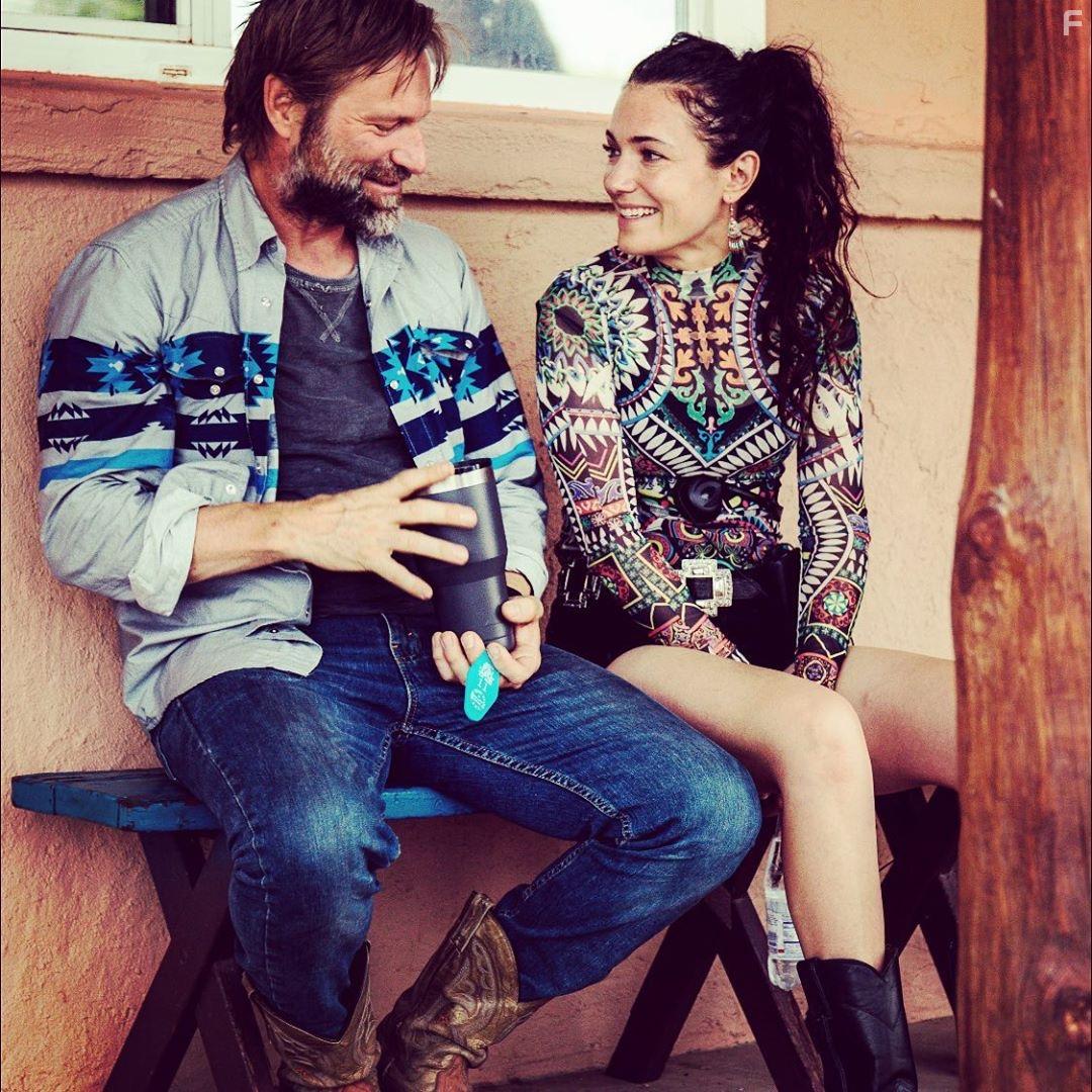 Aaron Eckhart and April Mullen in Wander (2020)