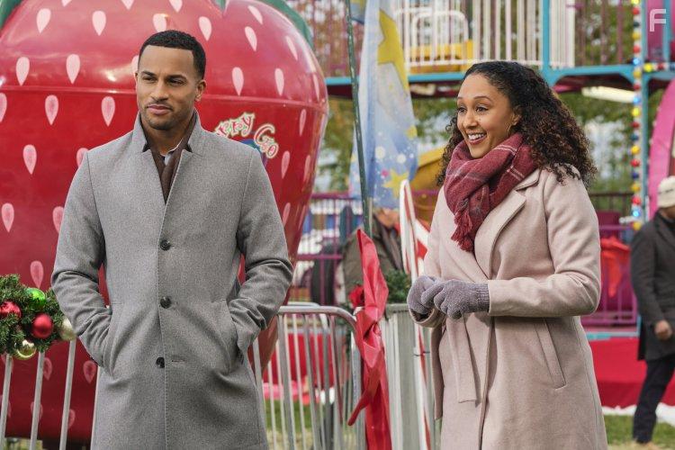 Tamera Mowry-Housley and Michael Xavier in Christmas Comes Twice (2020)