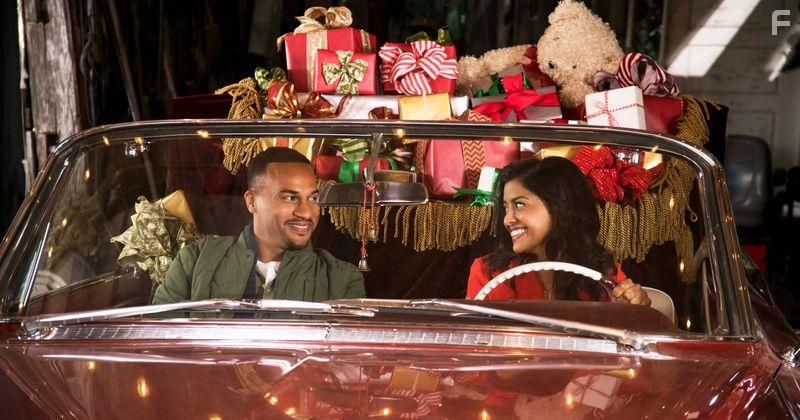 Tiya Sircar and Michael Xavier in Christmas on Wheels (2020)