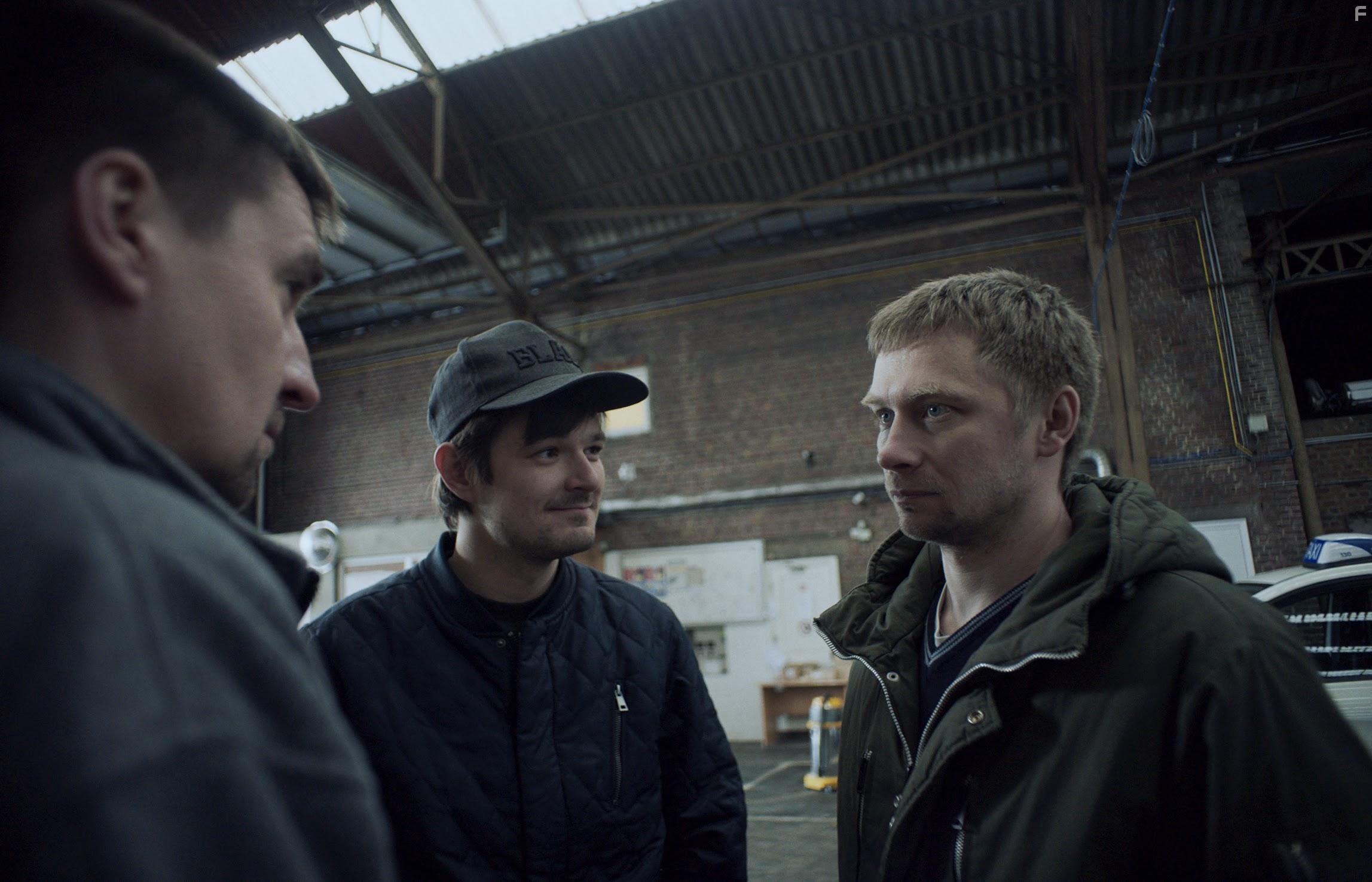 Valentin Novopolskij and Dawid Ogrodnik in Oleg (2019)